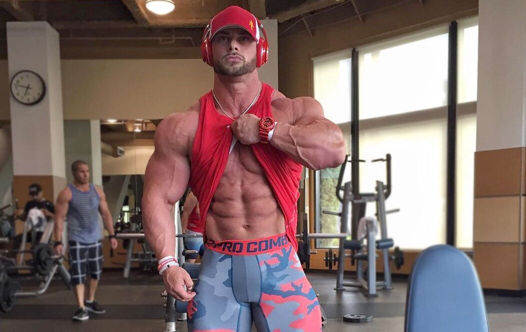 Man in the shape of sport in the gym
